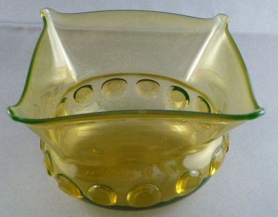 Webb? Honey Amber bowl 
Note the square rim profile and the applied prunts. Uranium glass
Keywords: british;blown;table