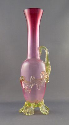 Graduated cranberry vase with uranium leaf and feet
Optic-ribbed. British?
Keywords: blown;british;vase