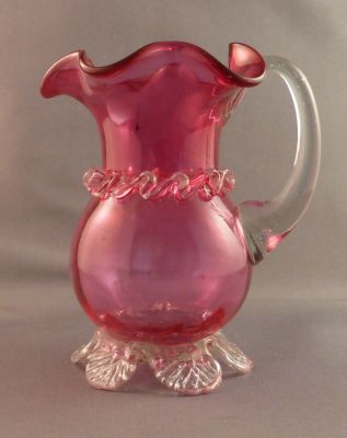 Victorian cranberry glass milk jug/creamer
British? Looks of striations and bubbles. 4.5 in tall
Keywords: british;blown;sold;table