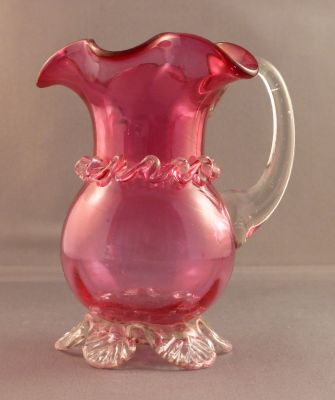 Victorian cranberry creamer
4.5 in. tall. Optic ribbing. Seeds and striations. Likely English
Keywords: table;sold;British