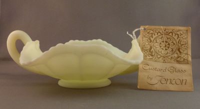 Fenton Butterflies nappy/bonbon
Original glassblower label and hang tag. Very thick glass. Uranium satin custard glass. 1972-85 but probably earlier rather than later
Keywords: american;pressed;table