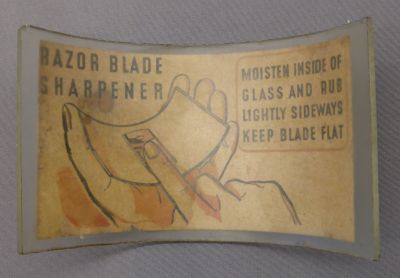 Razor blade sharpener
Likely English 2 x 5 x 3.5 in. Cut from a glass cylinder
Keywords: british;bathbed