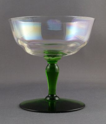 Iridescent, uranium-stem champagne coupe
Optic ribbing. ground rim. 1950s? Also suitable as a dessert dish
Keywords: barware;blown