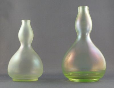 Fritz Heckert "cypern-glas" gourd vase
Little and large. Stretch iridescent finish on uranium glass. c. 1900. Made by Josephinenhutte.  (Thanks M) 5 and 6 in.
Keywords: czech;blown;vase