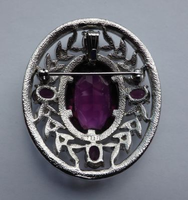 Faux amethyst and diamond brooch/pendant
Fitting for chain. Back marked 2352
Keywords: sold