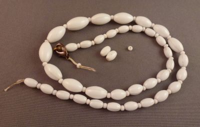 White glass beads
Moulded oval beads with spacers
